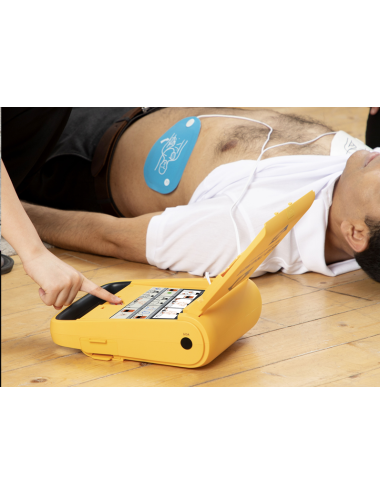 Desfibrilador semiautomático i3 con pantalla de guías visuales y botón de descarga.